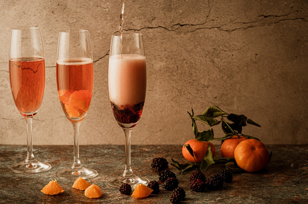 Rose in champagne glasses with fruit