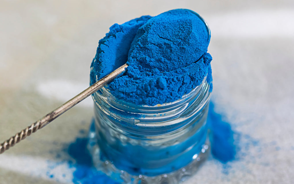 Jar of blue spirulina