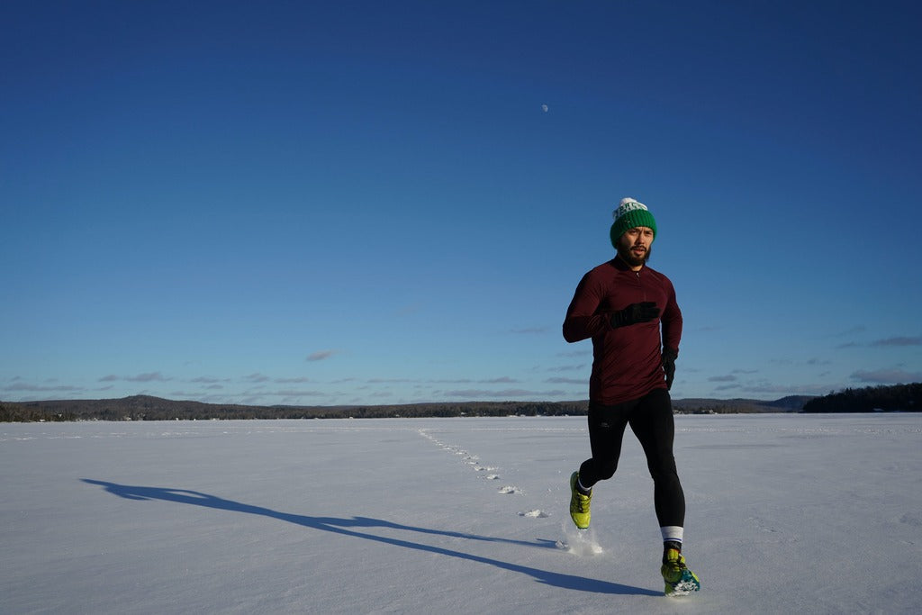 Man running through field of snow