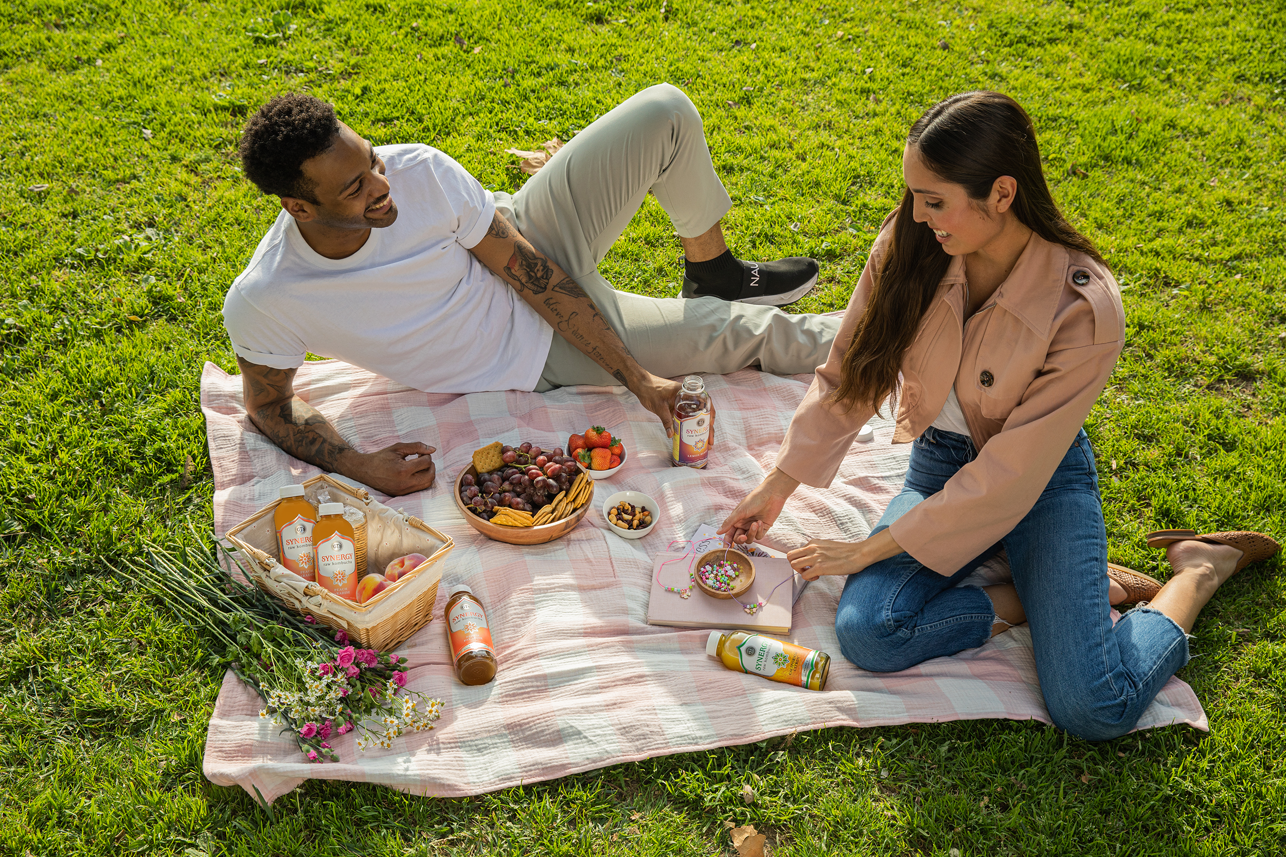 People picnicking with SYNERGY Kombucha