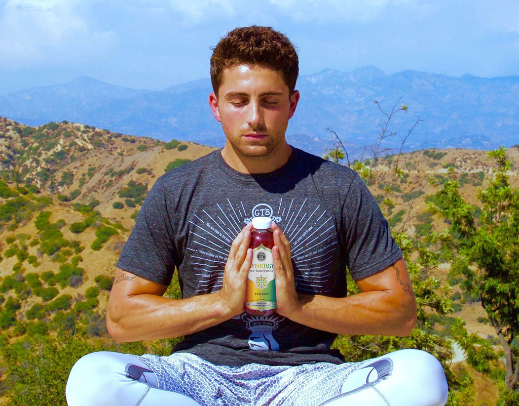 Man meditating on a mountain