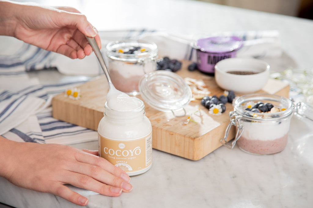 Person serving vanilla COCOYO Coconut Yogurt