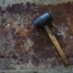 Rubber mallet. If your wheels are seized, don't use a metal hammer to pop them, use a rubber mallet.