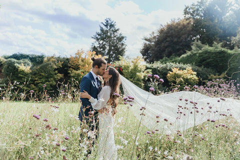 Kelly and Stephen in sun dappled field