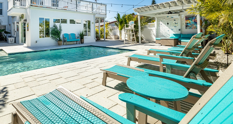 Chaise lounge chairs surrounding pool