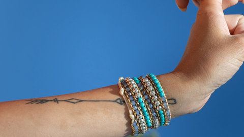 Floral bracelet tattoo with a bird - Tattoogrid.net