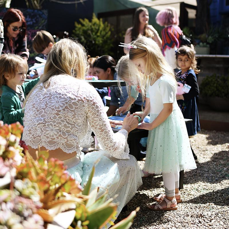 Photo - Woman doing arts and crafts with children