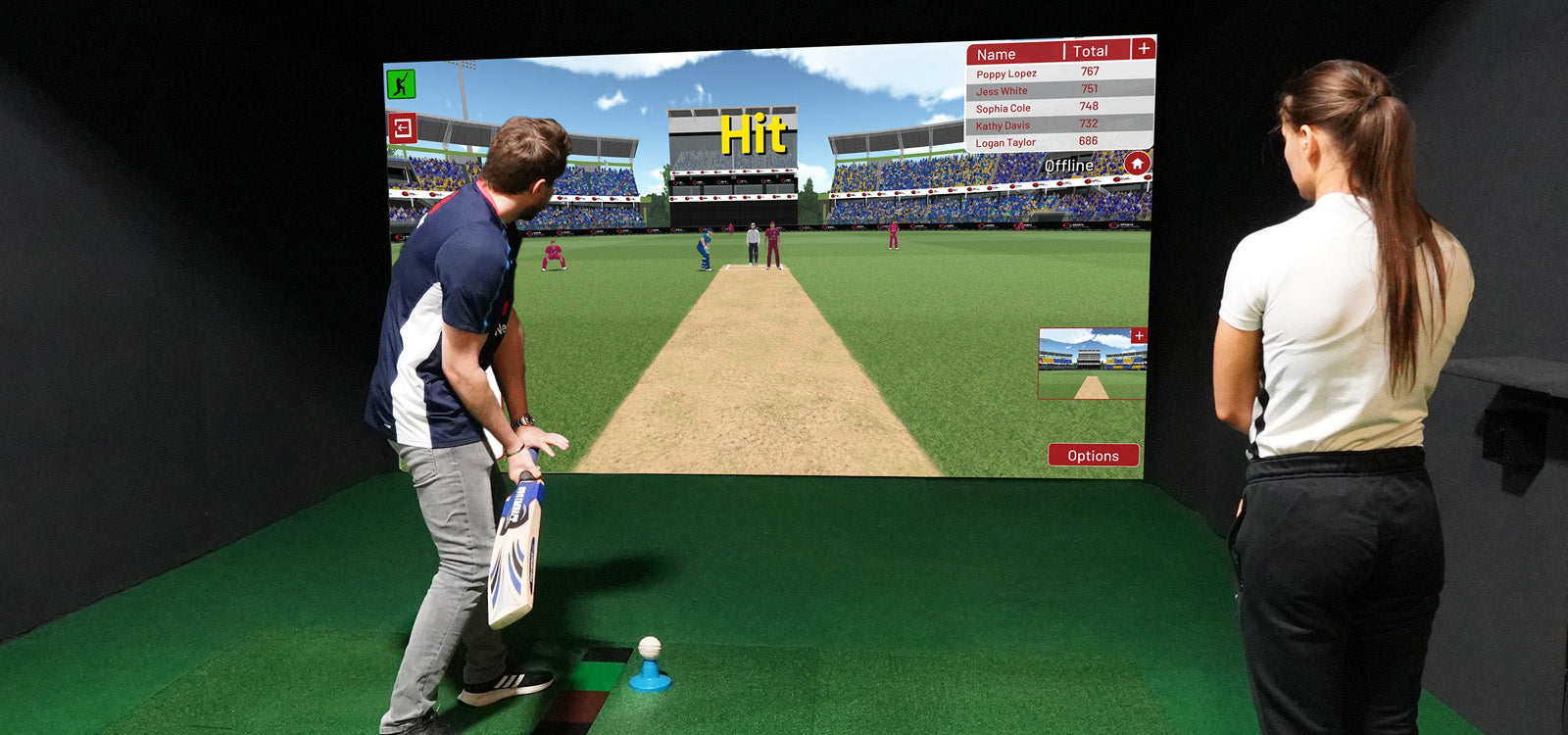 Man swinging cricket bat in Sports Coach simulator