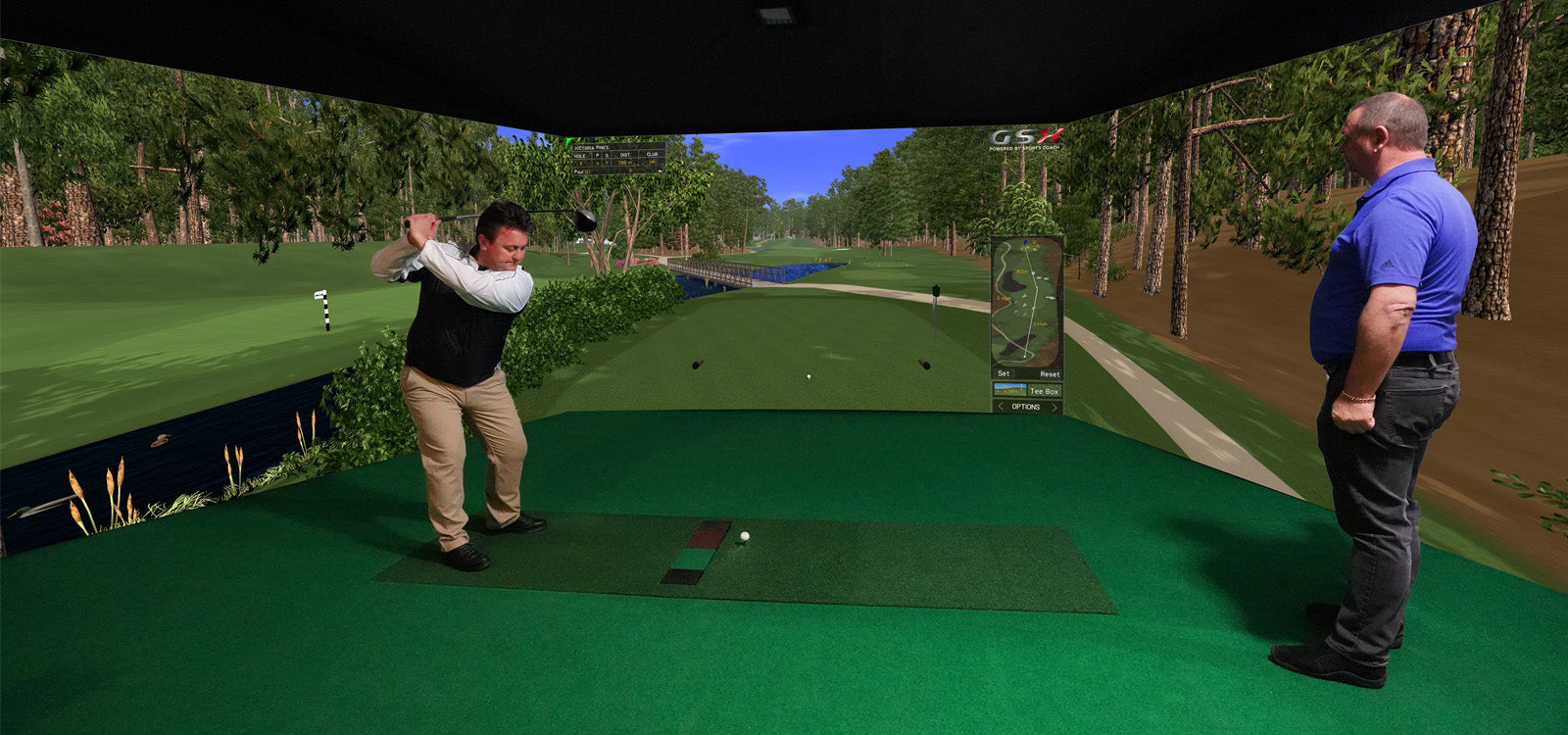 Man swinging golf club in Sports Coach simulator