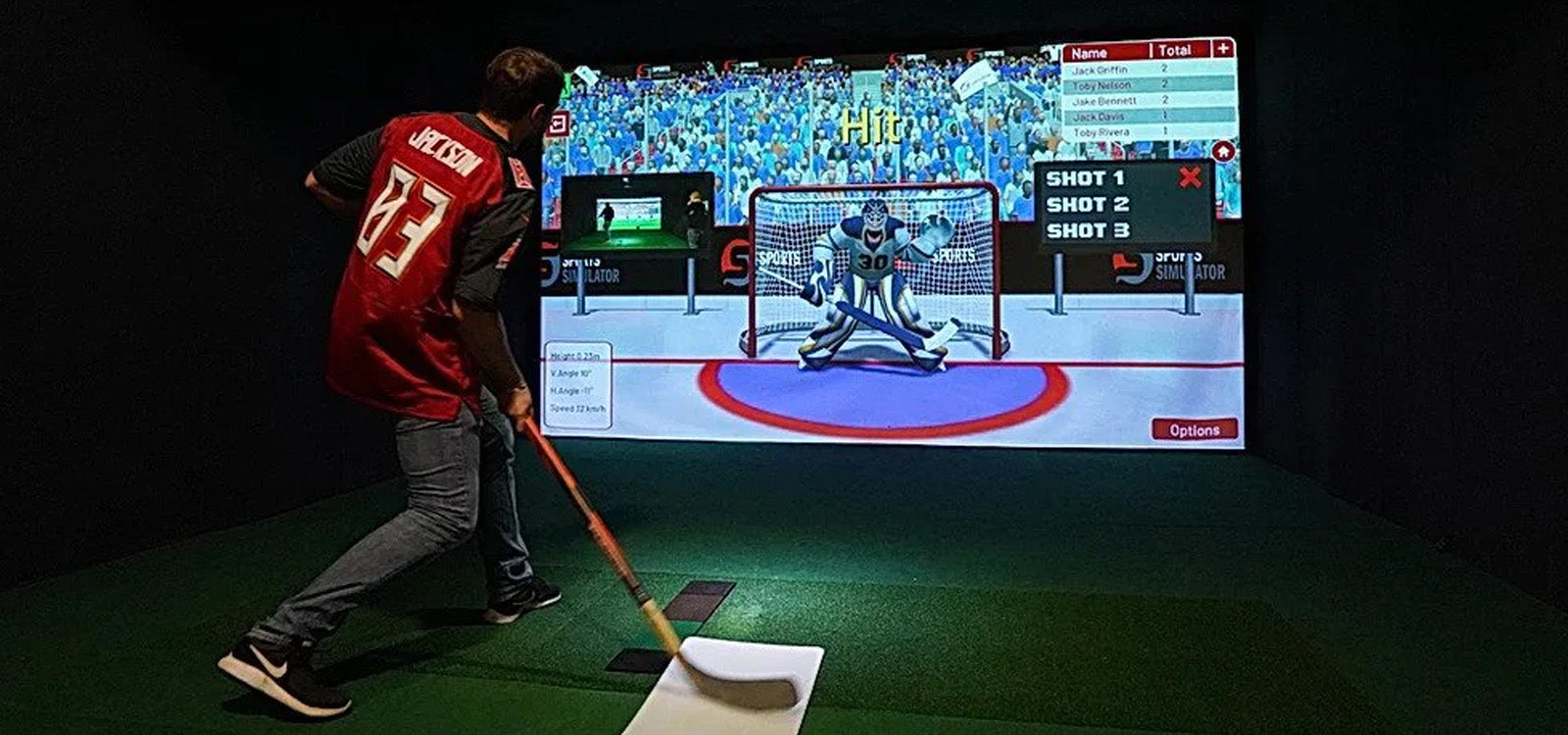Man shooting hockey puck in Sports Coach simulator