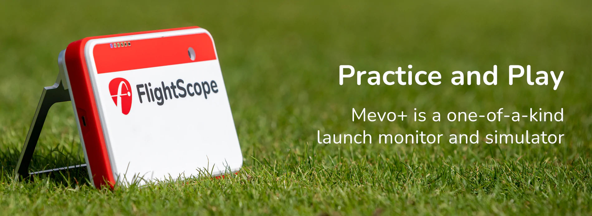 Mevo Plus launch monitor sitting in grass