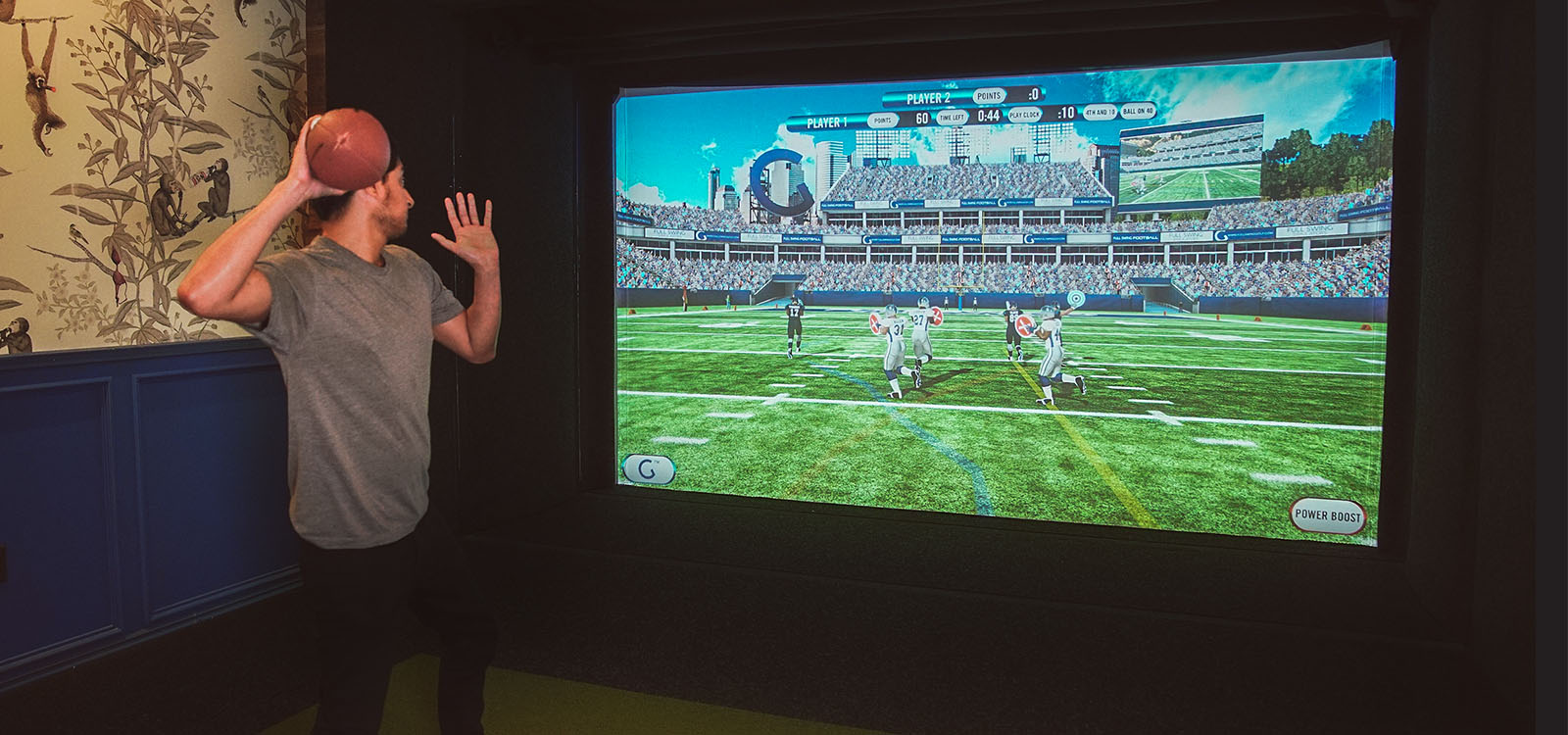 Man throwing football in Sports Coach simulator