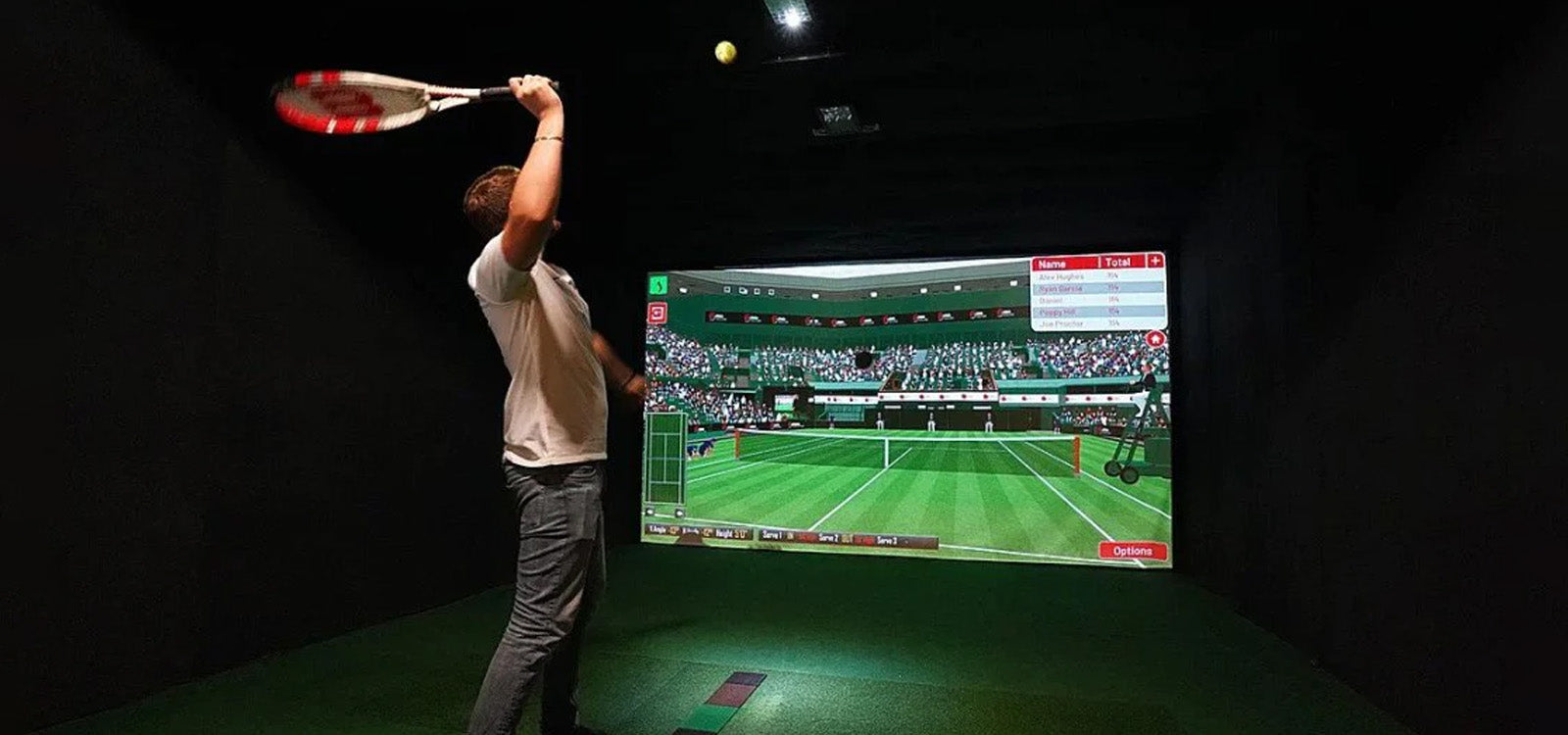 Man serving tennis ball in Sports Coach simulator