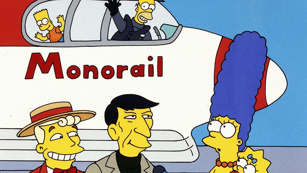 Lanley, Léonard Nimoy, et Marge devant le monorail avec Homer et Bart à l'intérieur