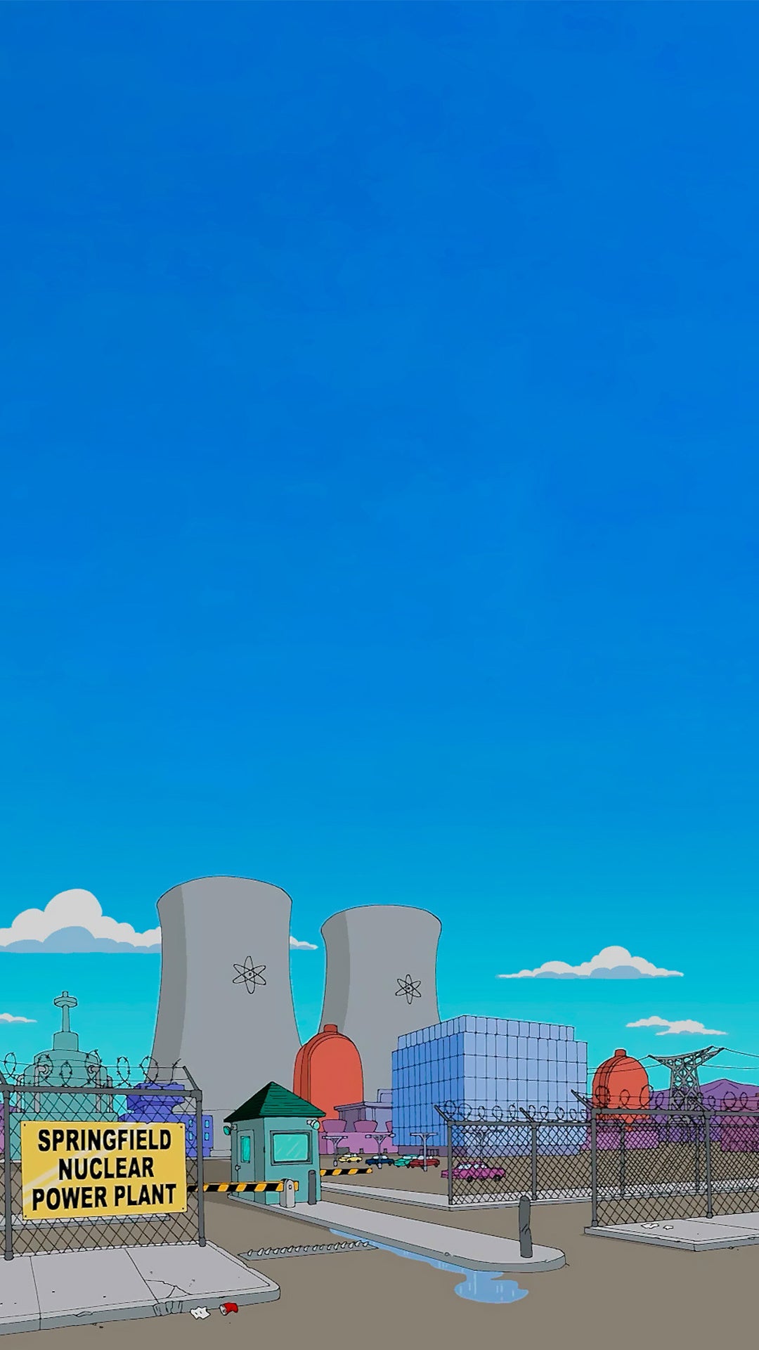 La centrale nucléaire de Springfield vue de loin avec un grand ciel bleu.