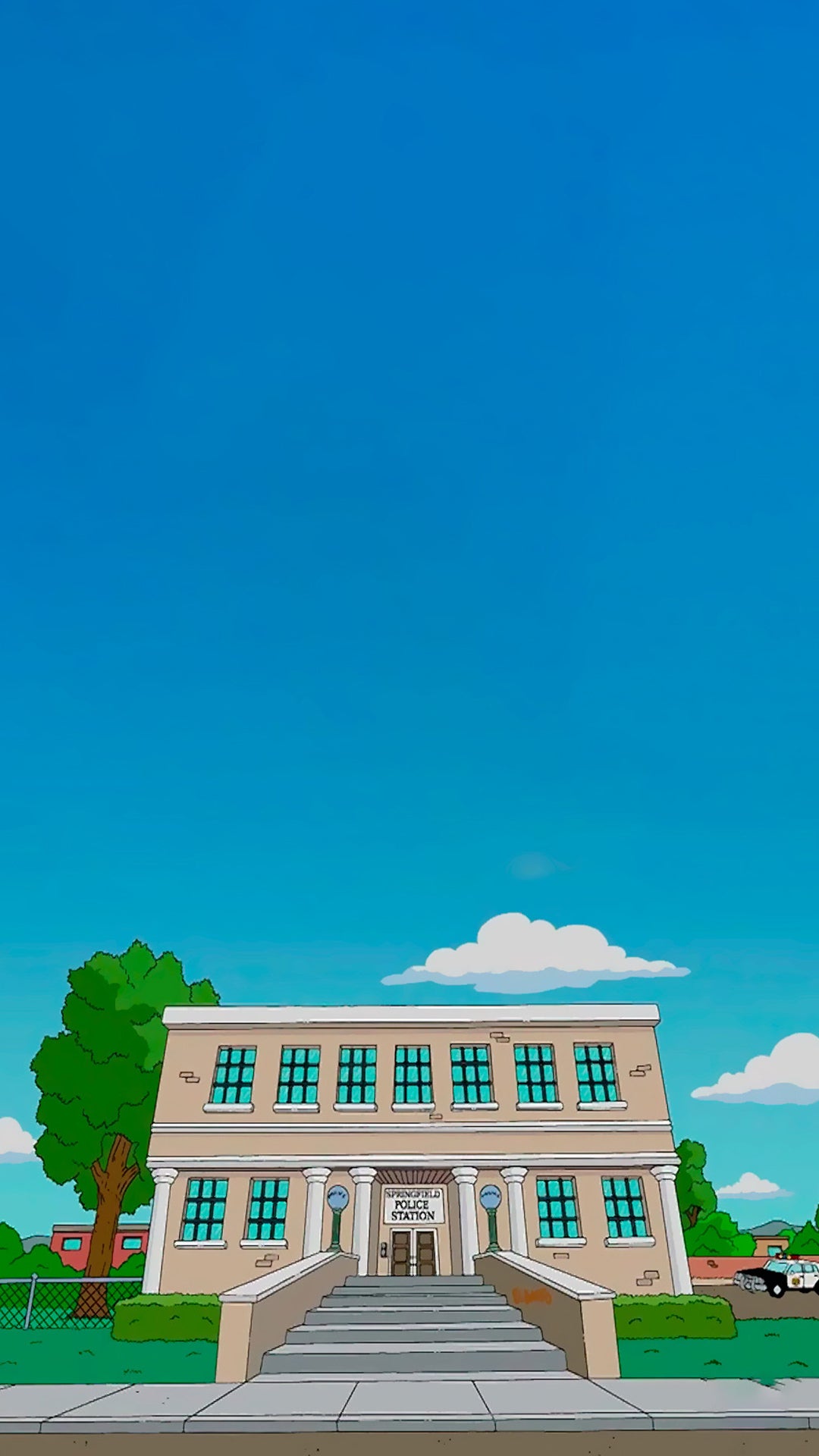 Le poste de Police de Springfield vue de face avec un grand ciel bleu.