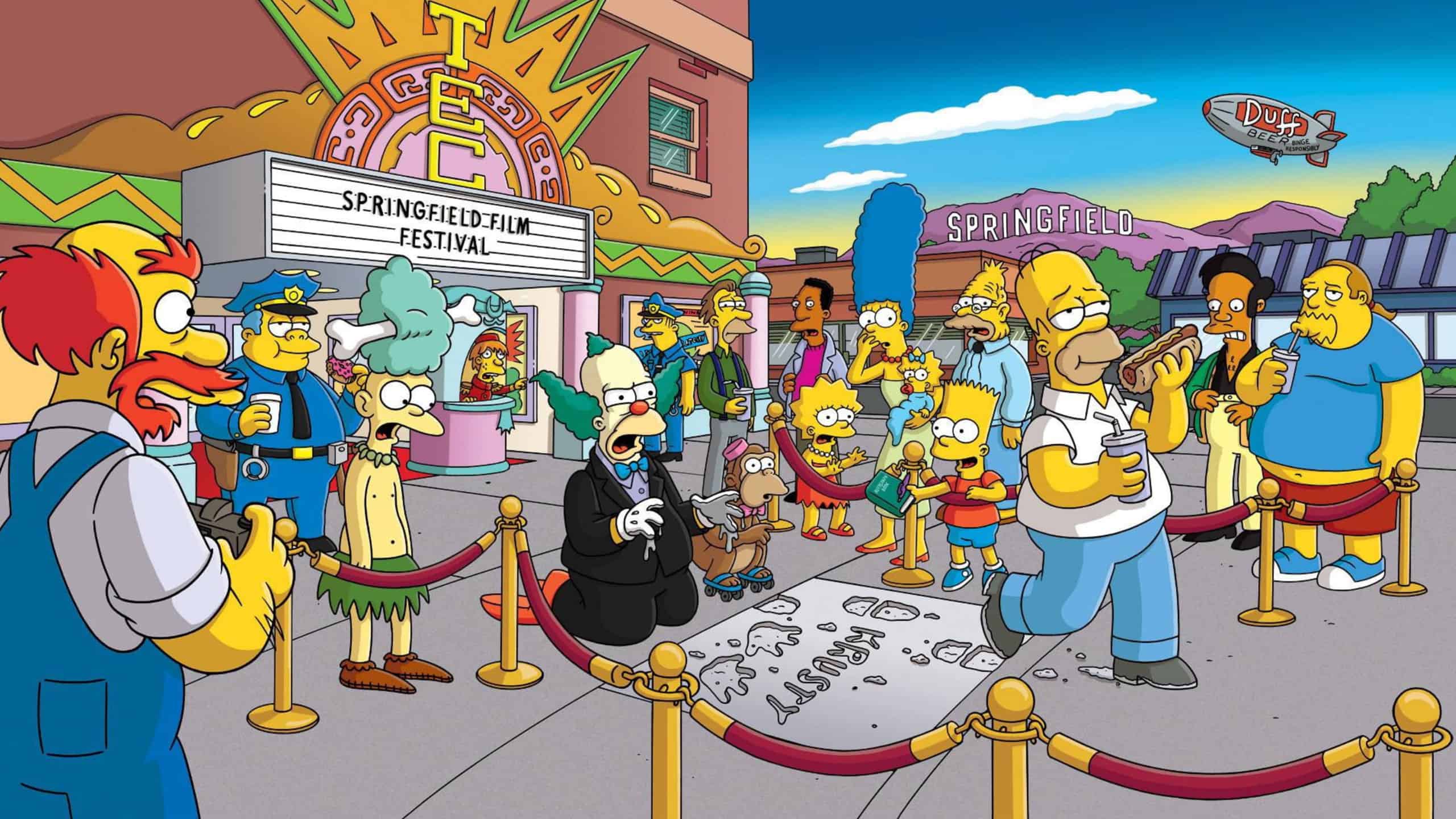 Homer piétine la cérémonie des mains de Krusty devant le cinéma et les habitants de Springfield choqués.