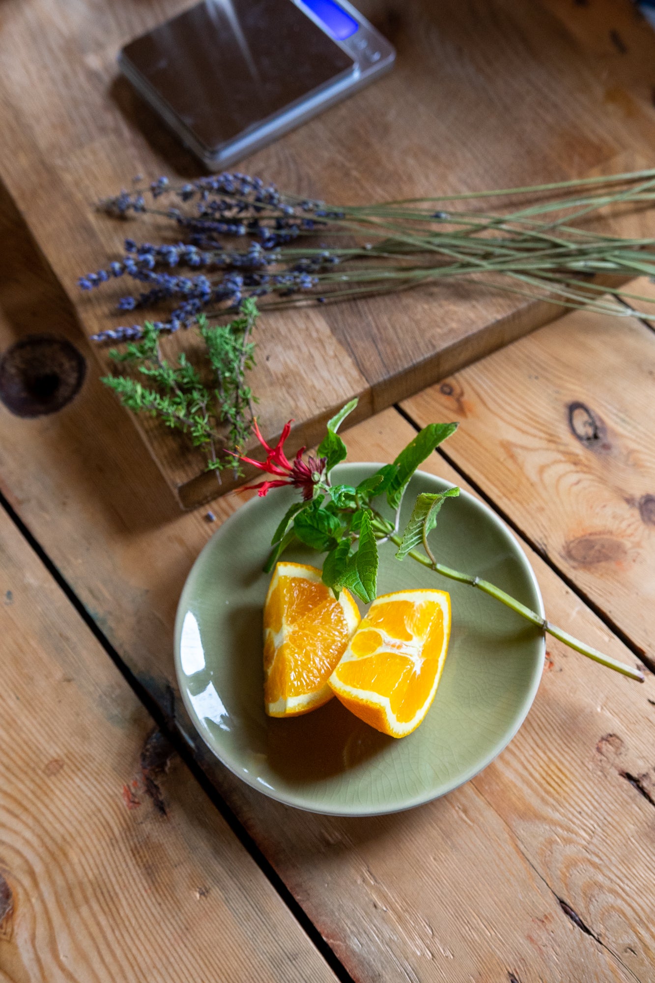 burgamot flower and orange wedge on dish