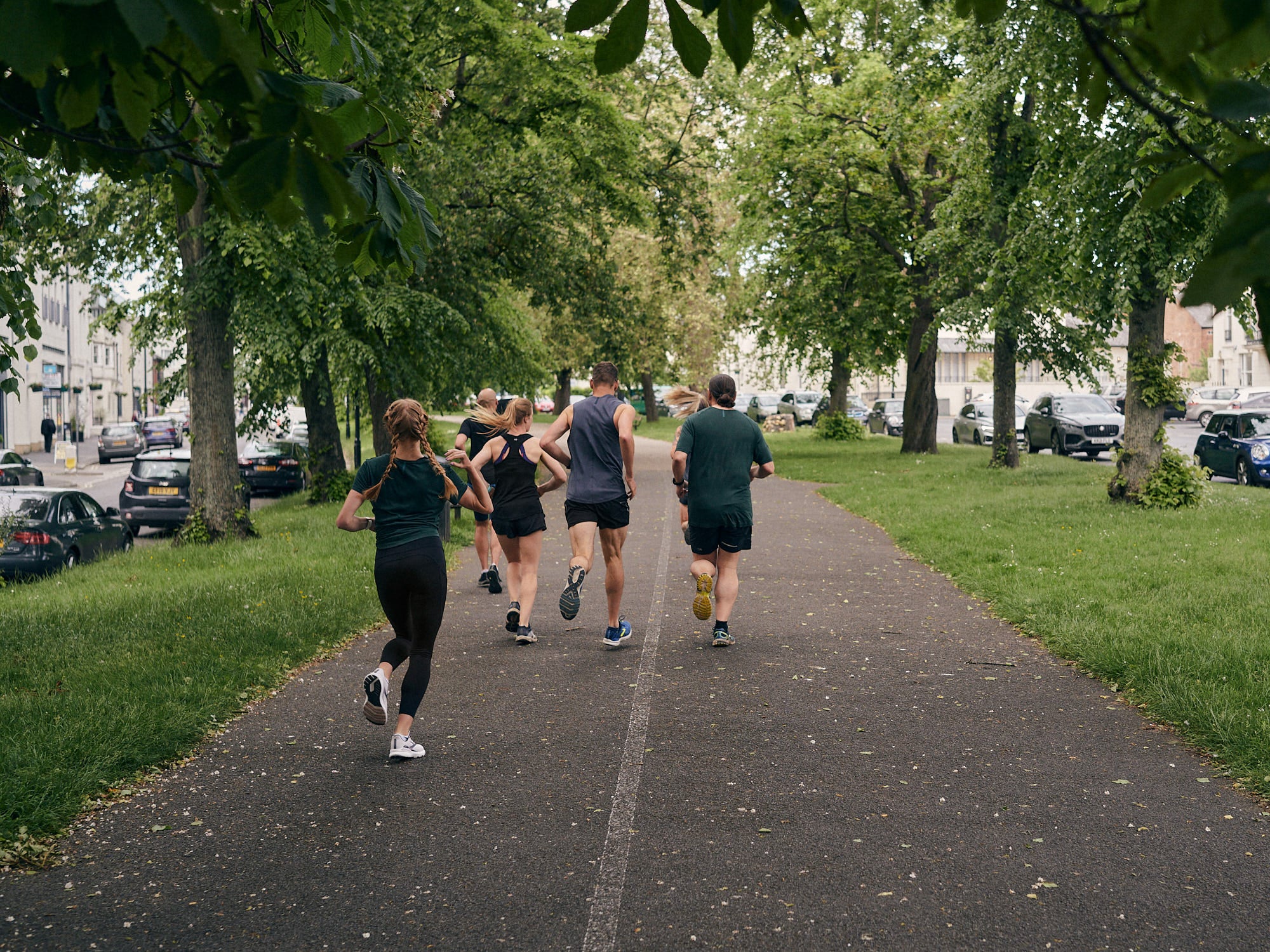 Back shot of people jogging