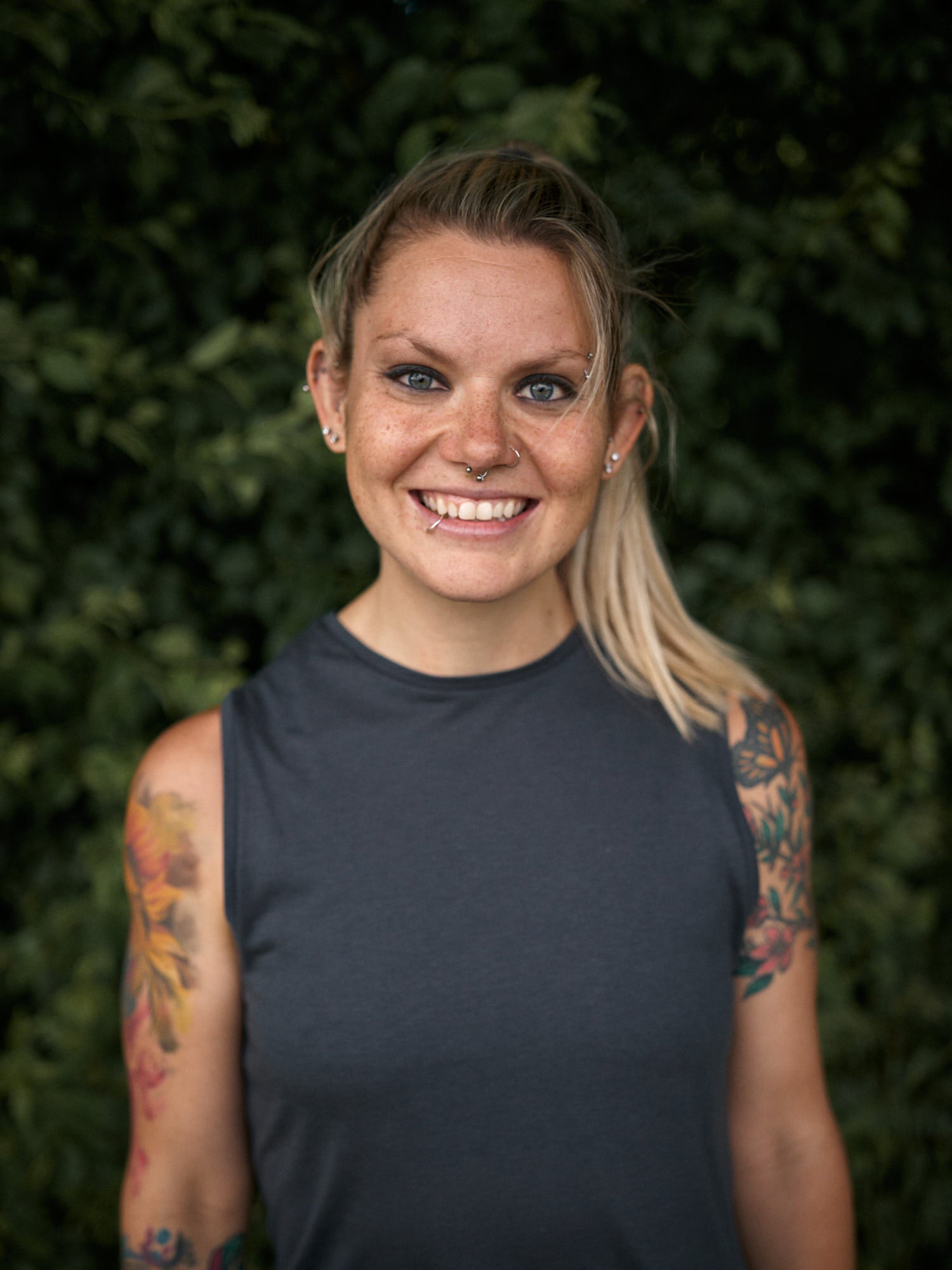 Woman with tattoos standing