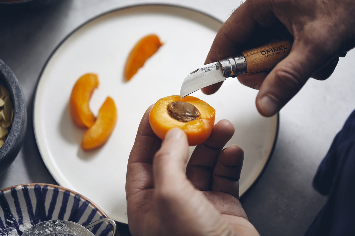 Chestnut knife cutting apricots