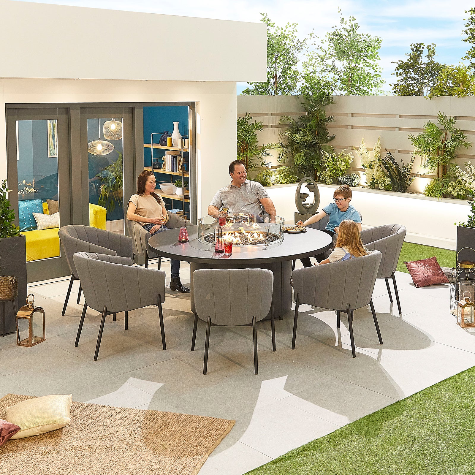 An image of Nova - Edge Fabric 8 Seat Round Dining Set with Firepit - Light Grey