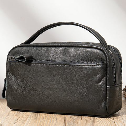 : A black leather toiletry bag from Saulho