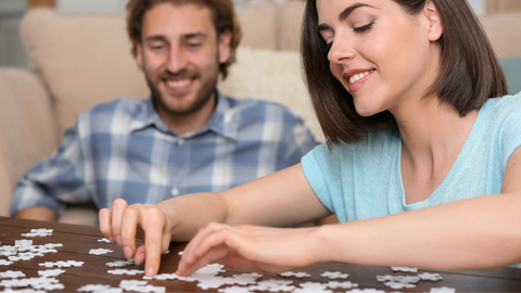 friends doing puzzle together