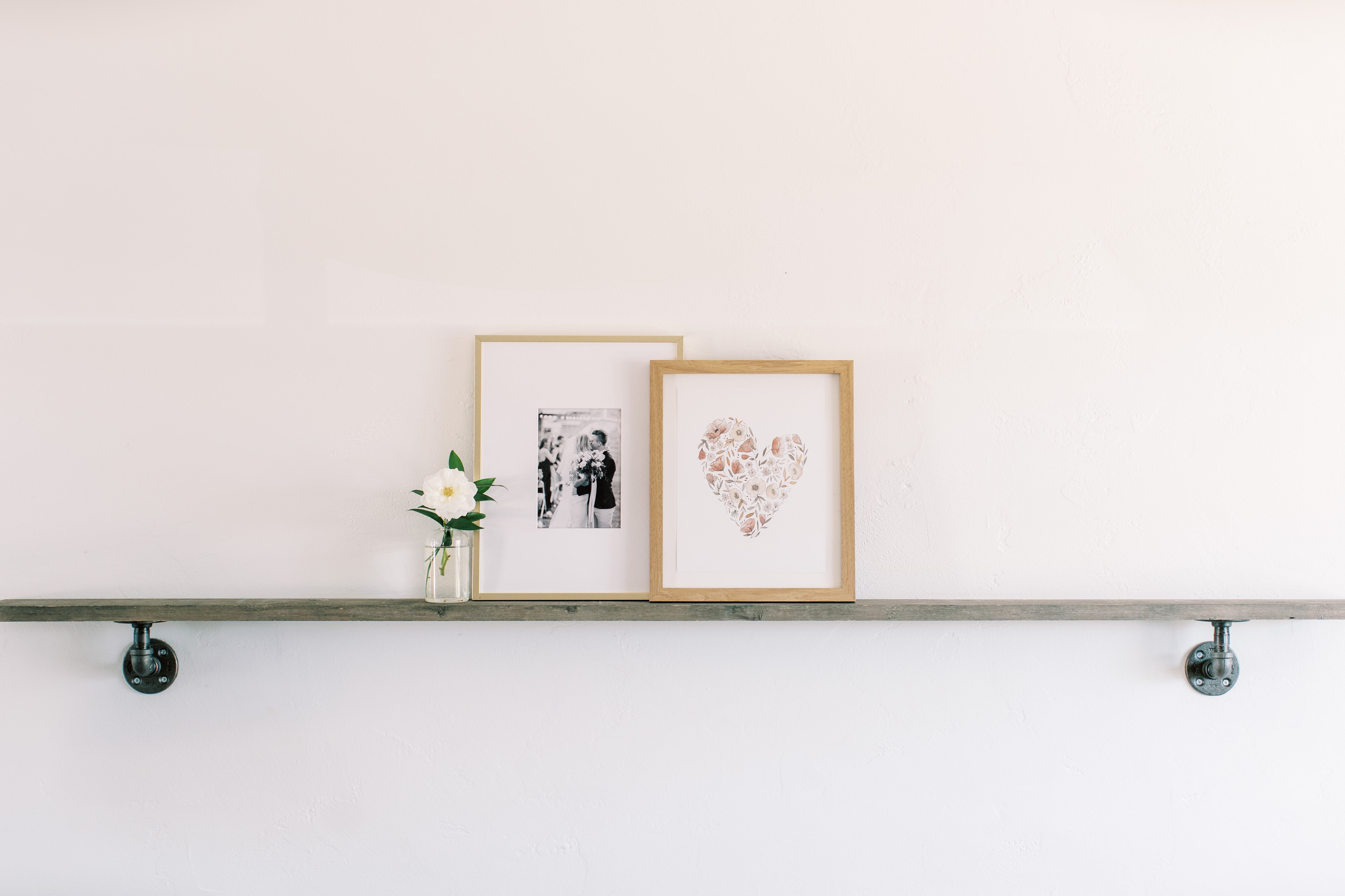 painting of floral hearts sitting on a shelf