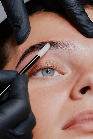 Eyelash extension client having a brow lamination treatment