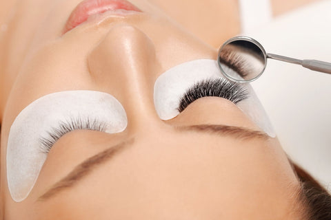 Close-up of eye lash extensions and under eye patches