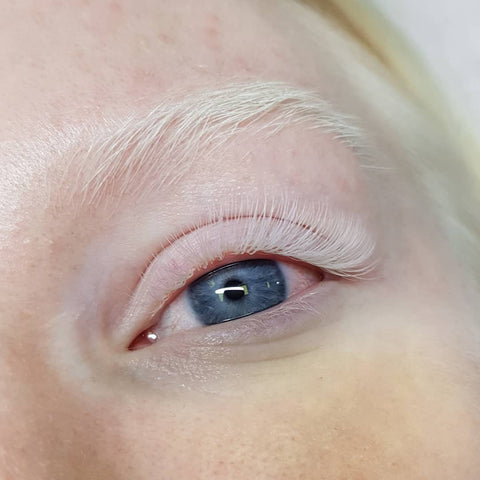Close-up of white coloured eyelash extensions