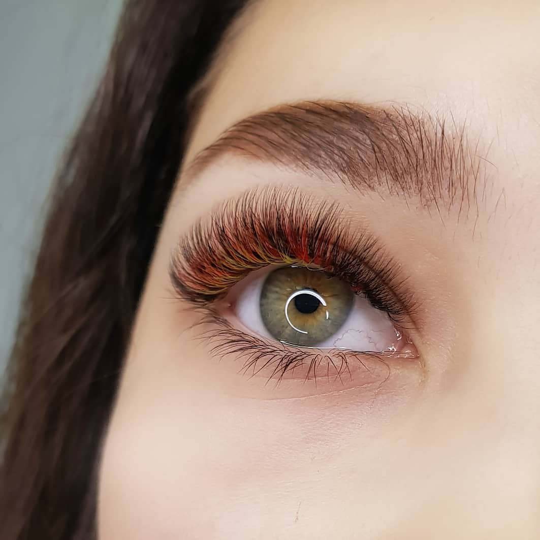 Orange and Yellow Lash Extensions on Bottom Layer of Lashes