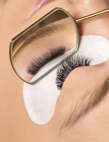 Lash mirror checking eyelash extensions with under eye patch