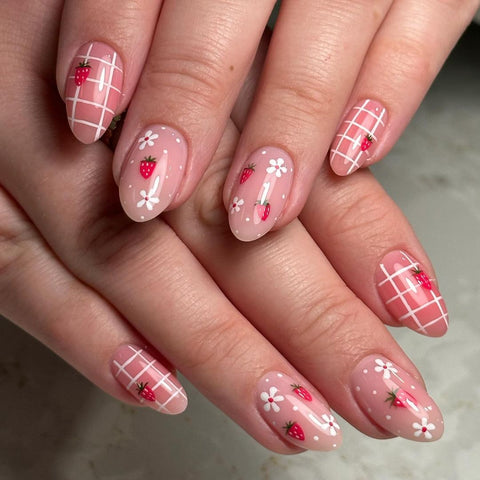 Strawberry themed nail art by Nail Technician