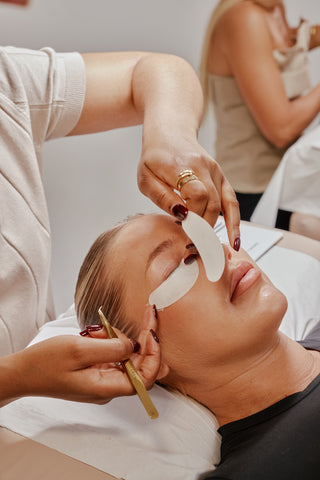 Lash Technician placing under eye patches for eyelash extensions
