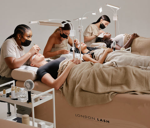 Lash Technicians on a lash course for lash extensions with a Lash Trainer