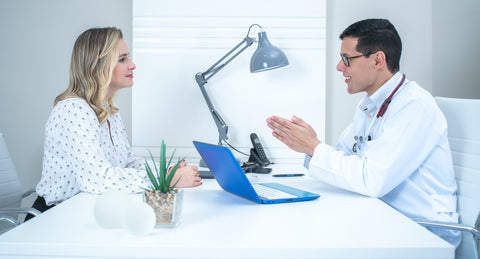 Doctor consulting with patient about how to treat blepharitis