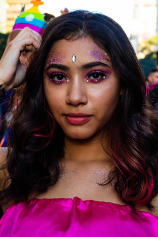 Glitter eyelash extensions and festival outfit
