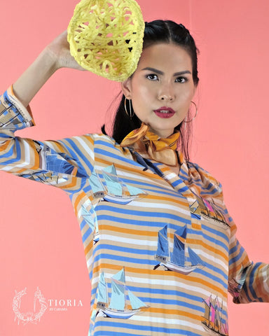An article highlighting the influence of Jakarta's traditional dish, Asinan Betawi, on the fashion designs of Tioria by Caramia. The piece vividly describes the connection between the dish's rich, diverse flavors and the brand's fusion of Indonesian cultural heritage with contemporary fashion elements