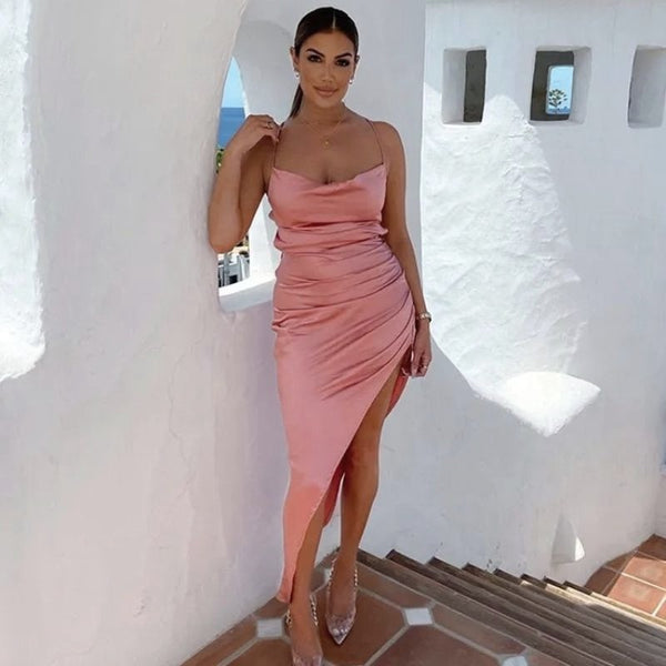 Woman wearing high slit figure hugging bodycon prom dress in pink
