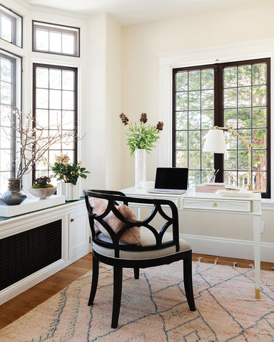 cutest pink moroccan rug in a small office with chair desk and bay window