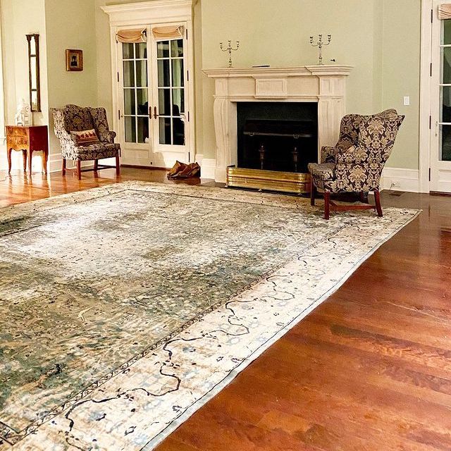 large oversized rug in formal living room