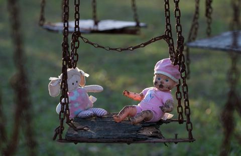 dolls on a swing
