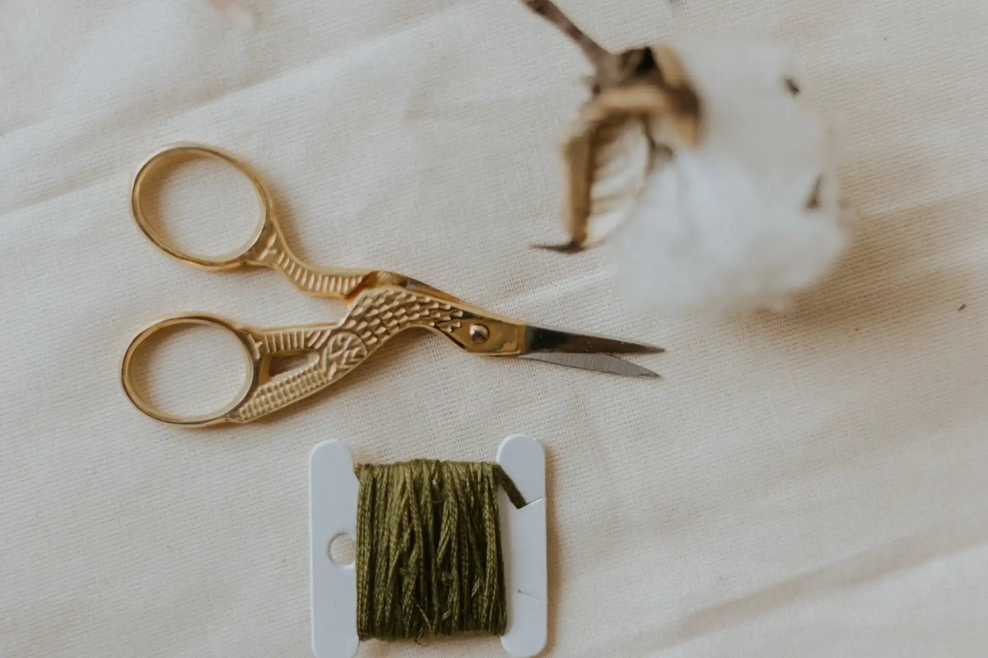 A Embroidery Scissors on a table.