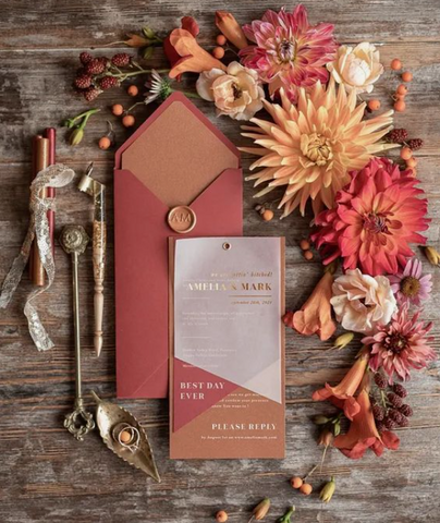 Image shows wedding stationary in rust and orange 