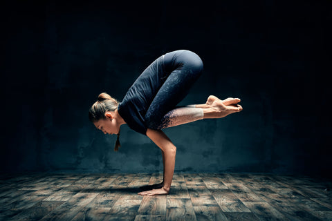 Woman in crow pose