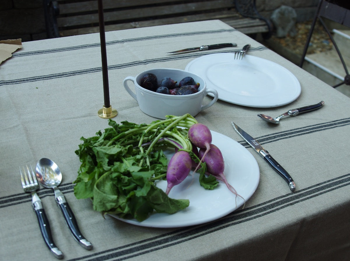 Black French cutlery on table with place setting