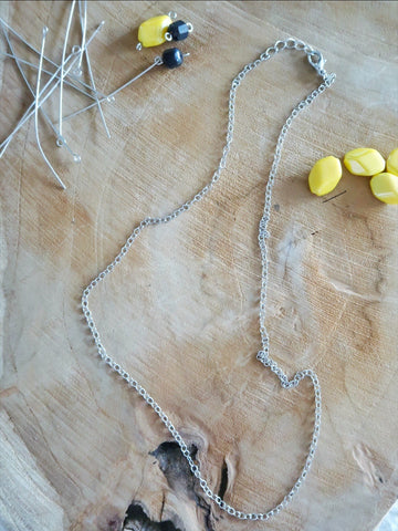Assemble a necklace with a chain and a clasp
