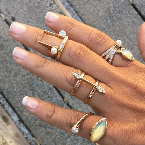 Four Stacking Rings On A Woman's Hand